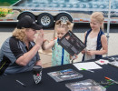 Cindi signs an autograph for a couple of young fans. (Photo: Jeff Boerio)
