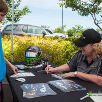 Cindi signs an autograph for a couple of young fans. (Photo: Jeff Boerio)