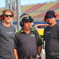 Crew Chief Fred Lux and two crew members wait for the car to come in.