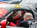 Fred helps to get Cindi strapped into the cockpit of the Viper. (Photo: Jeff Boerio)