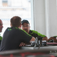 The Lux Performance crew discusses the strategy for the race.  (Photo: Jeff Boerio)