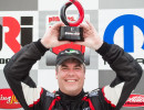 Steve Streimer brings home the first place trophy for Lux Performance.  (Photo: Jeff Boerio)