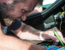 Chris Cox works on the fuel system for Cindi's car (Photo: Jeff Boerio)