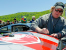 Cindi signs an autograph at Lime Rock. &nbsp;(Photo: Shawn Pierce Photography)