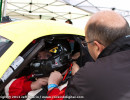 Crew Chief Fred Lux helps Cindi get strapped in.