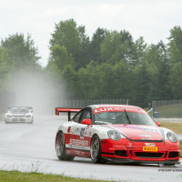 Steve leads into turn 10 during the Rose Cup Race, with Cindi running second. (Photo: Jeff Boerio)