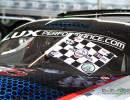 Cindi returns to the paddock with a checkered flag. (Photo: Jeff Boerio)