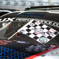 Cindi returns to the paddock with a checkered flag. (Photo: Jeff Boerio)
