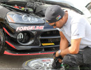 JP checks the Forgeline wheel and Pirelli tires before putting them on the car. (Photo: Chris Clark)
