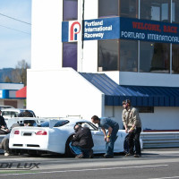 The Lux Performance crew takes readings on tires during a test session.