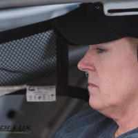 Cindi gets comfortable in her new racecar.